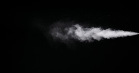 Real white smoke isolated on black background with visible droplets