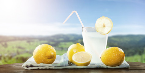 Fresh self-made lemon drink in a beautiful landscape