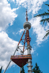 Fototapeta na wymiar TV tower on the sky background in Mtatsminda Park on the funicular.