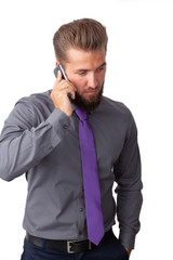 Attractive business man is talking on his smart phone