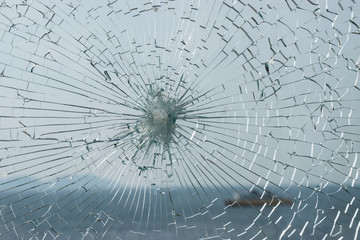 Broken glass with sea on background