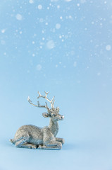 New Year's background. silver deer on a blue background.