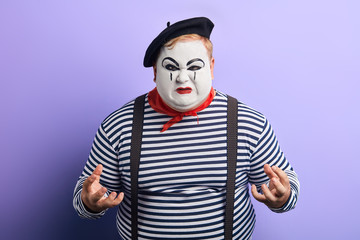 Obraz premium cruel unhappy sad nervous man being in panic, close up photo. isolated blue background.