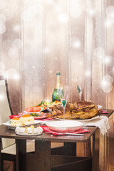 Christmas roast duck with apples served on a festive table