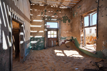 Inside an abandoned house in the mining ghost town of Kolmanskop in Namibia
