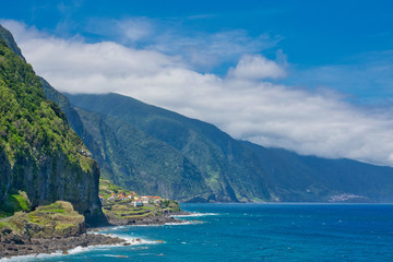 Fototapeta na wymiar Best panoramic adorable view blue water and blue sky viewpoint on Madeira island in Atlantic ocean view from Sao Vicente and Ponta Delgada to Porto Moniz in summer sunny day, Madeira island, Portugal 