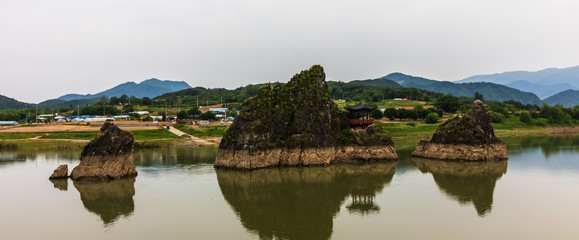 Panoramic view on Dodamsambong Peaks. Three stone peaks rising out of the Namhangang River. Danyang, North Chungcheong, South Korea, Asia.