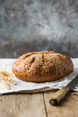 Fresh homemade crisp bread on wooden background. French bread. Bread at leaven. Unleavened bread