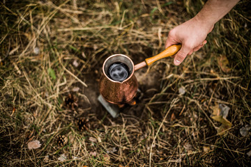 Making coffee while camping on the stove