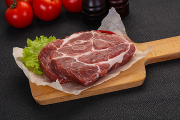 Raw pork neck steak
