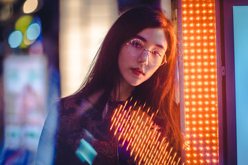 Pretty asian woman portrait with led lights
