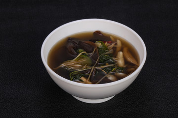 Thai style soup with meat and mushrooms