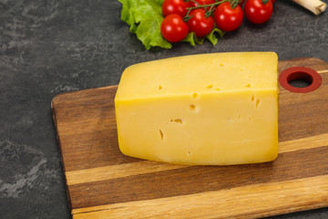 Hard yellow tasty cheese brick