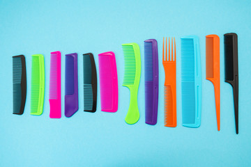 Plastic combs isolated on blue background
