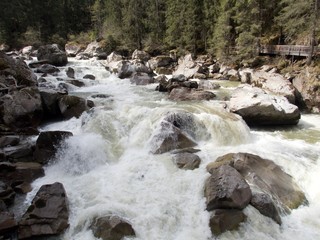 wild mountain creek with stones