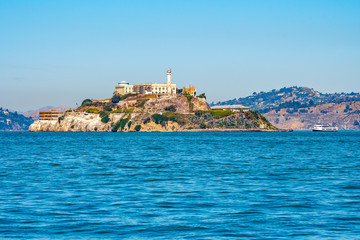 Fototapeta na wymiar Alcatraz Prison Island in San Francisco Bay, offshore from San Francisco, California, a small island with military fortification and federal prison, now a famous national historical landmark.
