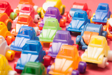 Toys  plastic cars on a red background