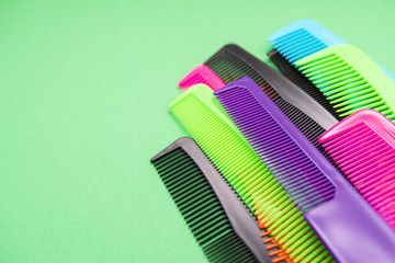 Plastic combs isolated on green background