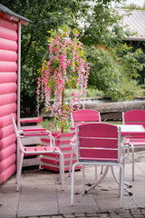 Pink furniture in street cafe  