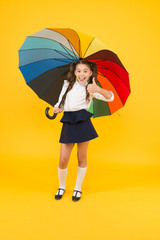 Fashion accessory. Rainy september. Accessory for rainy day. Stay dry. Fancy schoolgirl. Girl with umbrella. Rainy day. Happy childhood. Rainbow style. Kid happy with umbrella. Fall weather forecast