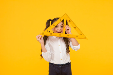 Knowledge day. Schoolgirl school uniform hold big ruler geometry school lesson. Triangle right angle. Math stem architecture faculty. Measuring equipment. Kid cute school student study mathematics