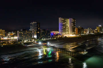 Fototapeta na wymiar Aerial night photo Myrtle Beach fishing pier and hotel condominiums