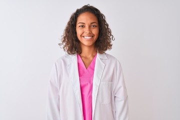 Young brazilian doctor woman wearing coat standing over isolated white background with a happy and...