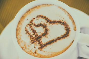 Cup of coffee with two hearts. It s symbol of Love in foam. It's a delicious sweet hot drink.