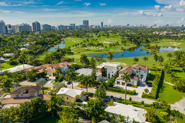Fototapeta na wymiar Luxury Miami Beach mansions on golf course landscape