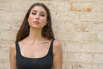Attractive woman posing in a black tank top shirt
