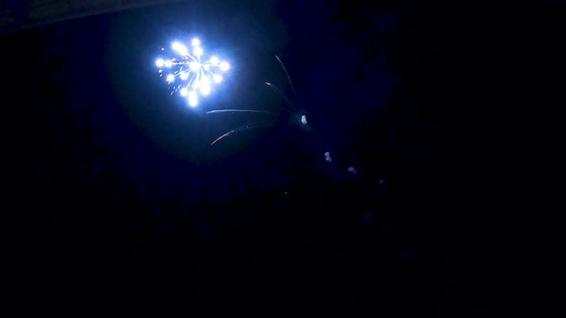 A beautiful but simple firework display in the dark of night.  Segment 3 of 5 in slow motion.  One part of a longer clip when placed together.