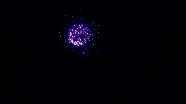 A beautiful but simple firework display in the dark of night.  Segment 5 of 5 in slow motion.  One part of a longer clip when placed together.