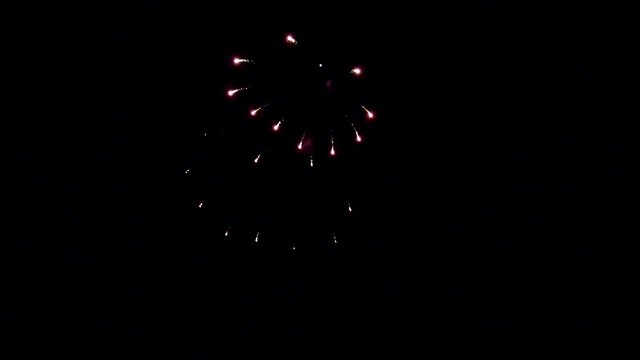 A beautiful but simple firework display in the dark of night.  Segment 2 of 5 in slow motion.  One part of a longer clip when placed together.