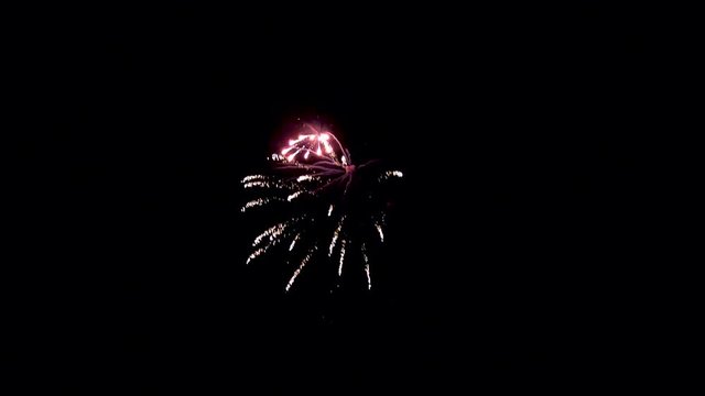A beautiful but simple firework display in the dark of night.
