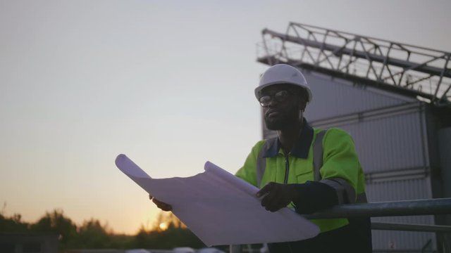 Construction engineer with blueprints