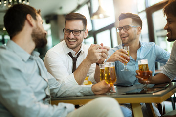 Business people enjoy and work in a cafe and drink beer