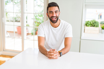 Handsome man smiling cheerful with a big smile on face showing teeth, positive and happy expression