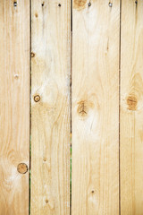 Naklejka premium Vertical texture of wooden raw boards close up.