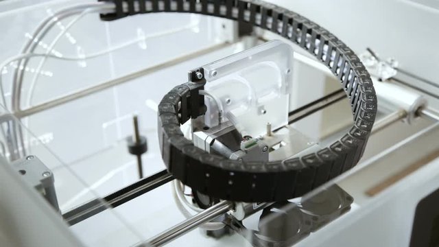 3d printer working and printing an object.