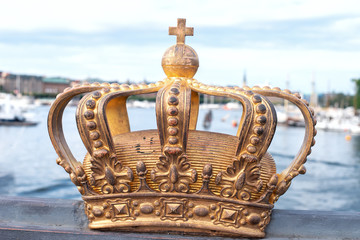 Fototapeta na wymiar Skeppsholmsbron (Skeppsholm Bridge) with golden crown In Stockholm