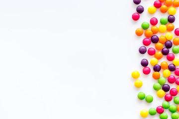 Assorted sweets and dots on white background top view space for text