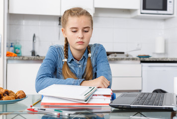 Girl tired of doing her homework