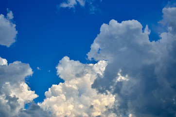 White clouds on the background of the blue sky