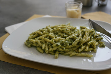 Troffie al pesto, pasta speciality of the Ligurian cuisine with sauce from garlic, pine nuts, basil and parmesan cheese