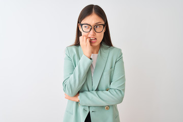Chinese businesswoman wearing elegant jacket and glasses over isolated white background looking...