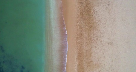 Aerial top down view of Senhora da Rocha beach, in the south coast of Algarve tourist destination region, Portugal.