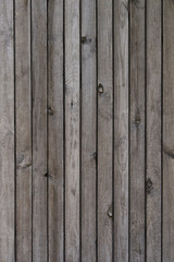 Naklejka premium Old grey wooden texture background. Vertical arrangement.