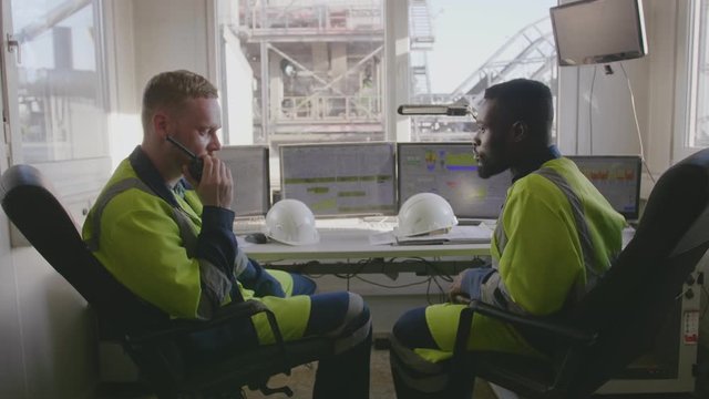 Engineers working in control room