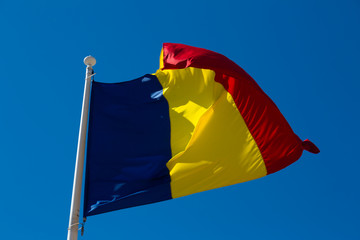 Romanian flag is fluttering in the wind