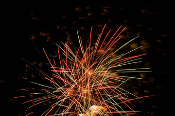 Salute, fireworks in the night sky.